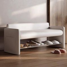 a white couch sitting on top of a wooden floor