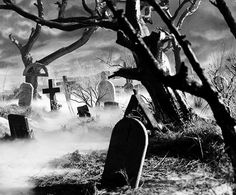 black and white photograph of graveyard with tombstones