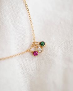 This exquisite necklace, crafted from 14k yellow or white gold, is the epitome of elegance and sophistication. A perfect keepsake to commemorate beloved family members and cherished loved ones. 14k solid gold 2mm small round bezel charm with lab created birthstone •• January—Garnet •• February—Amethyst •• March—Aquamarine •• April—White sapphire •• May—Emerald •• June—Alexandrite •• July—Ruby •• August—Peridot •• September—Sapphire •• October—Tourmaline •• November—Topaz •• December—Blue zircon Personalized Dainty 14k Gold Birthstone Necklace, 14k Gold Birthstone Necklace With Round Stone, Dainty 14k Gold Charm Necklace For May Birthstone, Dainty 14k Gold May Birthstone Charm Necklace, Fine Jewelry Yellow Gold May Birthstone Necklace, 14k Gold Charm Necklace With May Birthstone Gemstone, Minimalist 14k Gold Charm Necklace With May Birthstone, May Birthstone Necklace In 14k Gold With Bezel Setting, 14k Gold May Birthstone Necklace With Bezel Setting