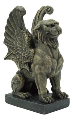 a statue of a lion with wings on it's back