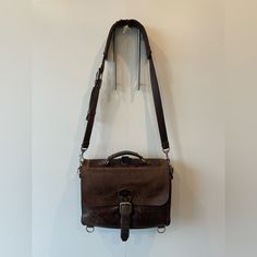 This Stylish And Sturdy Messenger Bag Is A Must Have! Saddleback Leather Co Is Known For Their Highest Quality Leather And Durable Bags. The Briefcase Is Super Functional And Over-Engineered Without A Single Breakable Part Like Magnets, Snaps, Or Zippers. This Has Been Used And The Distressed Look Is The Point Of These Bags. Brown Leather Briefcase With Detachable Strap, Brown Briefcase With Leather Handles For On-the-go, Saddleback Leather, Brown Leather-handled Crossbody Briefcase, Vintage Leather-handled Briefcase Shoulder Bag, Vintage Brown Leather-lined Rectangular Briefcase, Leather Briefcase, High Quality Leather, Messenger Bag