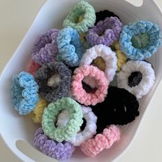 A bucket of pastel colored velvet crochet scrunchies Velvet Yarn Scrunchie, Crochet Velvet Scrunchie, Crochet With Velvet Yarn, Velvet Yarn Projects, Yarn Scrunchies, Crochet Velvet Yarn, Velvet Yarn Crochet, Crochet Hair Tie, Shoe Tutorial