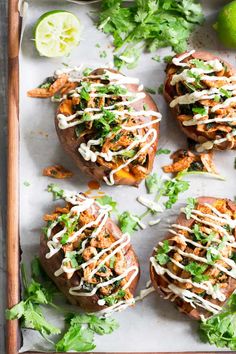 baked sweet potatoes topped with taco sauce and cilantro