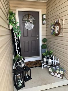 the front porch is decorated with black and white decorations