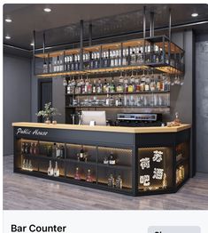 the bar counter has many bottles on it and shelves with liquors in them,