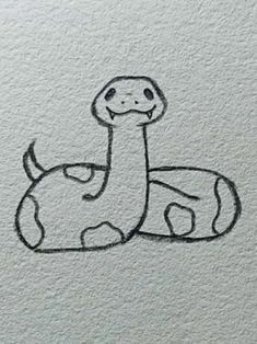 a drawing of a snake sitting on top of a white paper with the words, i love