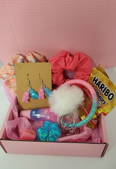 a pink box filled with lots of different items