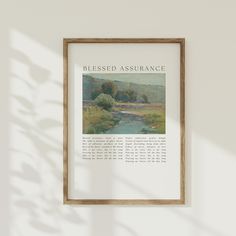 a framed poster hanging on the wall above a river