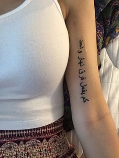 a woman's arm with writing on it