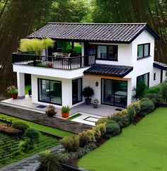 an aerial view of a house in the middle of some trees and grass with bushes