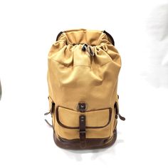 18oz Cotton Canvas with a commercial grade water repellent. Cinch top with flap. Full Grain Leather Trim Matte Gold Metal Tooth Zipper Size: 21" x 13" x 8" Canvas Backpack, Unique Bags, Best Bags, Matte Gold, Full Grain Leather, Leather Trims, Water Repellent, New Bag, Cotton Canvas