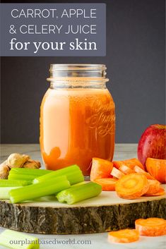 a jar filled with carrots and celery sitting on top of a table