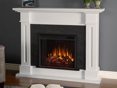 a fire place with a book on the table