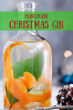 homemade christmas gin in a glass bottle with orange slices