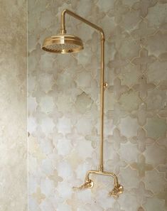 the shower head is gold in color and it has no faucet or handset