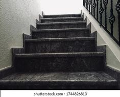 a set of stairs leading up to an open door