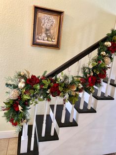 christmas garland on the banisters with red and green flowers