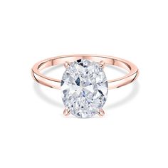 a rose gold ring with an oval cut diamond