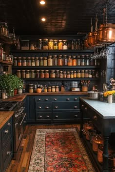 a kitchen with lots of pots and pans on the shelves