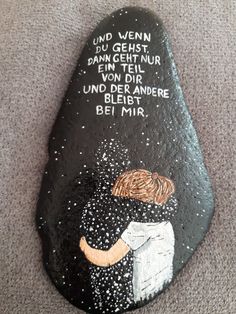 a painted rock with words written on it