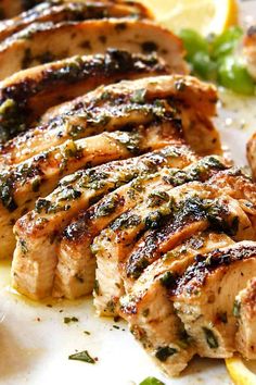 grilled meat with herbs and lemon slices