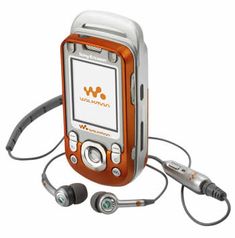 an orange and white cell phone with ear buds