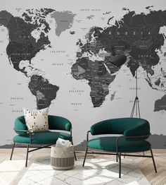 two chairs in front of a wall with a world map on it