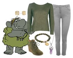 a woman in grey pants and green sweater with an elephant on her arm, wearing gray shoes