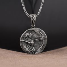 Artemis Silver Necklace 3D, Collectable Medallion, Handmade Pendant Necklace Gift, Greek Mythology Necklace for Women, goddess Necklace Made of 925 silver and handcrafted by hand, this ring is not only an accessory piece that complements your daily elegance, but also has details that will reflect your character and style. It is also a great gift to give to your loved ones on their special days. At SavisSilver, we always give importance to the satisfaction of our customers, we recommend you to re Silver Goddess Medallion Necklace, Goddess Style Silver Medallion Necklaces, Goddess Style Silver Medallion Necklace, Handmade Silver Goddess Necklace, Silver Mythological Necklace For Gift, Mythological Style Silver Necklace For Gift, Silver Handmade Mythological Necklace, Handmade Silver Mythological Necklace, Handmade Silver Goddess Jewelry