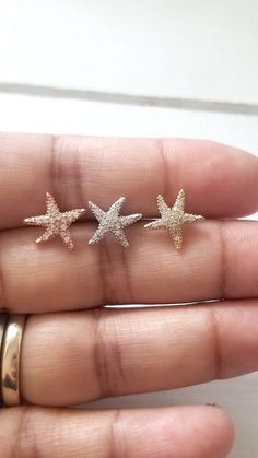 Stunning Starfish earrings with cubic zirconia. Perfect gift for your, bridesmaids or for anyone who loves the sea! The CZ's are hand set and are AAA quality, full of fire... the pictures don't show the sparkles. Starfish earrings with Sparkly CZ - Available in 3 colors: 1) Plain Sterling Silver 2) Rose gold over Sterling Silver 3) Yellow gold over Sterling Silver The Starfish design measures 12mm height x 12.5mm width ** Please note: Our pictures are zoomed in to show detail, please read the me Rose Gold Star Earrings For Anniversary, Dainty Sparkling Rose Gold Earrings, Starfish Design, Starfish Earrings, Silver Rose Gold, Gold Plating, Starfish, Rose Gold Plates, The Sea