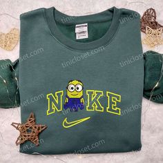 Minion x Nike Embroidered Shirt, Cartoon Embroidered Hoodie, Nike Inspired Embroidered Sweatshirt Welcome to Tinicloset, your one-stop destination for the most adorable and iconic custom embroidered shirts and apparel that will surely tickle your fancy and make you fall in love with fashion all over again. Our store is a treasure trove of creativity, where we blend the whimsy of Minions and the style of Nike to bring you a unique fusion of cuteness and iconic fashion. At Tinicloset, we believe t Nike Inspired, Embroidered Apparel, Embroidered Shirts, Iconic Fashion, Embroidered Clothes, Embroidered Sweatshirt, Embroidered Hoodie, Embroidered Sweatshirts, Great Love