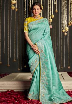 Kajal aggarwal Silk bollywood Saree in sea green colour 5225 Desc: Style : Bollywood Sarees Color : Sea Green Fabric : Silk Wash Care : Dry clean Sleeve Style : Half Sleeve Long Sleeves : Done only in Custom Stitch Sleeves Lining : Done only in Custom Stitch Bust Size : 32 to 42 Inches Occasion : Festival Diwali Eid Durga Pooja Ganesh Charturthi Dussehra. With Express Free Shipping Buy Indian Party wedding wear Bridal Sarees Kajal aggarwal Silk bollywood Saree in sea green colour 5225 online in Saree Embroidery, Raw Silk Saree, Yellow Saree, Green Saree, Art Silk Sarees, Contrast Blouse, Fancy Blouses, Embroidery Motifs, Soft Silk Sarees