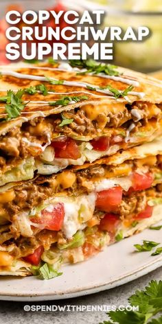 two quesadillas stacked on top of each other with text overlay that reads copycat crunchwrap supreme