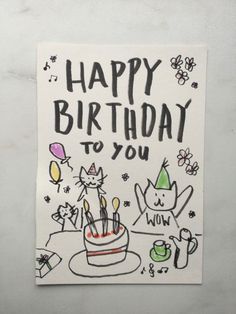 a happy birthday to you card with cats and balloons in the background on a white surface