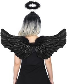 a woman with black and white hair is wearing an angel wings costume, while the back of