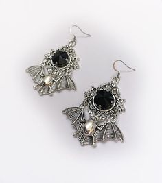 These large gothic vampire inspired earrings are made with antiqued silver plated bats, filigree settings and stainless steel earring hooks,  accented with sparkling glass crystals in JET BLACK. Earrings measure 2 3/4" tall and are 1 7/8" wide.Matching necklace is available in our shop. If you would like these in a different stone color, please send us a message. Gothic Silver Metal Earrings, Silver Gothic Metal Earrings, Gothic Earrings For Halloween, Gothic Nickel-free Earrings For Halloween, Gothic Nickel-free Halloween Earrings, Gothic Nickel Free Earrings For Halloween, Gothic Silver Pierced Earrings, Gothic Silver Dangle Earrings, Silver Gothic Dangle Earrings