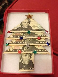 a christmas tree made out of dollar bills