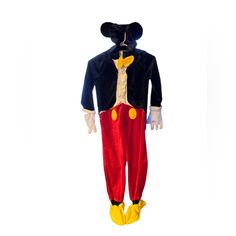 an adult size mickey mouse costume with yellow feet and black jacket, standing on a white background