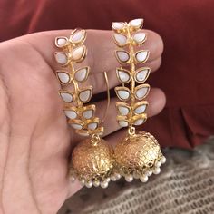 Very beautiful Bali and jhumki style hoop earrings.semi precious stones two color White : pre order and shipping time 4-6 weeks. Hand crafted and gold plated kundan indian/pakistani jewelry Material:brass,stone,gemstone,pearl We bring you casual as well as party wear jewelry which comes with an attractive design and style. It goes well modern and traditional outfits. Visit my website for more collections https://www.etsy.com/shop/Noorzaracollection Elegant White Danglers With Stone Work, Bollywood Style Festive Hand Set Danglers, Traditional Hand Set White Pearl Earrings, Traditional White Hand-set Pearl Earrings, White Stone Work Earrings For Gift, White Earrings With Stone Work For Gift, White Jewelry With Latkans For Celebration, White Bridal Earrings With Stone Work For Celebration, Celebration White Jewelry With Latkans