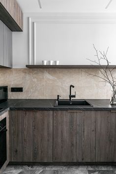 a kitchen with marble counter tops and wooden cabinets