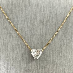 A gorgeous Heart Shaped Diamond Pendant in a white gold setting with rose gold chain. This lovely diamond measures larger than its size to give you that extra bang for your buck. Center Diamond Shape: Heart ShapeCenter Diamond Weight: 1.01 ct Diamond Color: GDiamond Clarity: SI1 (Slightly Included) Certificate: GIA 2225463578Excellent Cut & Polish, Very Good SymmetryNo Fluorescence Metal: 14K GoldSetting: Prong Set Head Style: 3 Prong Basket Chain Length: 17 Inches Luxury Heart-shaped Necklace With Prong Setting, Formal Heart Cut Necklace With Prong Setting, Diamond White Heart Cut Solitaire Necklace For Anniversary, Dazzling White Diamond Necklace With Heart Cut, Rose Gold Diamond Heart Necklace With Brilliant Cut, Gold Heart Cut Brilliant Diamond Necklace, White Diamond Necklace With Single Cut Heart Shaped Diamonds, White Heart-cut Diamond Solitaire Necklace, White Heart Cut Diamond Solitaire Necklace