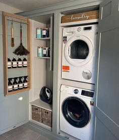 a washer and dryer in a small room with the door open to reveal it's contents