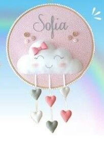 a pink and white cloud with hearts hanging from it's side next to a rainbow