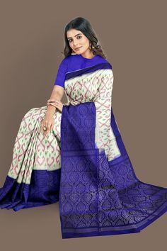 Transform yourself with this luxurious soft silk saree, featuring a classic half white and royal blue brocade patola design. Feel regal in its elegance and be the talk of any gathering. Enjoy the beauty and comfort of this stunning saree! Banarasi Silk Ikat Print Saree For Wedding, Wedding Banarasi Silk Saree With Ikat Print, White Ikat Print Traditional Wear For Diwali, Wedding Saree In Banarasi Silk With Ikat Print, Wedding Saree In Art Silk With Ikat Print, Silk Saree With Ikat Print For Wedding, Wedding Saree In Ikat Print Art Silk, Silk Wedding Saree With Ikat Print, Festive Blue Dola Silk Pre-draped Saree