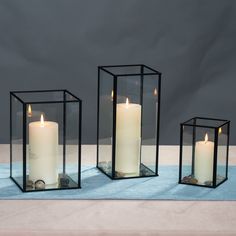 PRICES MAY VARY. Pack & Size: Including 3 pcs glass candle holder, LARGE SIZE: 10.6 x 5.1 x 5.1 inches, MEDIUM SIZE: 9 x 5.9 x 5.9 inches,SMALL SIZE:5.9 x 3.9 x 3.9 inches. Simple & Modern Design: The black candle holder is made of black metal frame and transparent glass. No rust and no fading. Protect Desktop Design: The glass hurricane candle holder adds a layer of velvet bottom to protect your desktop from scratches from glass and metal. Perfect Candle Holder Decoration: The modern candle hol Tapper Candles, Black Candle Holder, Geometric Candle Holder, Silver Lanterns, Clear Glass Table, Glass Candelabra, Geometric Candles, Black Candle Holders, Electronic Candles