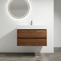 a bathroom with a sink, mirror and wooden cabinet in it's center area