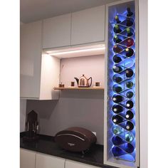 a wine rack in the corner of a kitchen