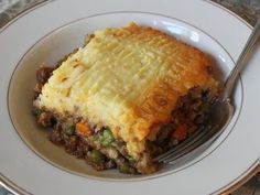 a piece of pie on a plate with a fork