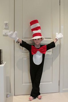 a little boy dressed up as the cat in the hat