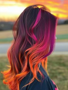 The fiery sunset style is a dramatic blend of red, orange, and purple that mimics the evening sky. This look is particularly striking on those with dark complexions and can be a showstopper at any social event. Orange Hair Color Ideas, Orange Hair Color, Unique Braided Hairstyles, Boho Braided Hairstyles, Amazing Waterfall, Waterfall Hairstyle, Sunset Hair, Pink Blonde Hair, Hair Color Orange